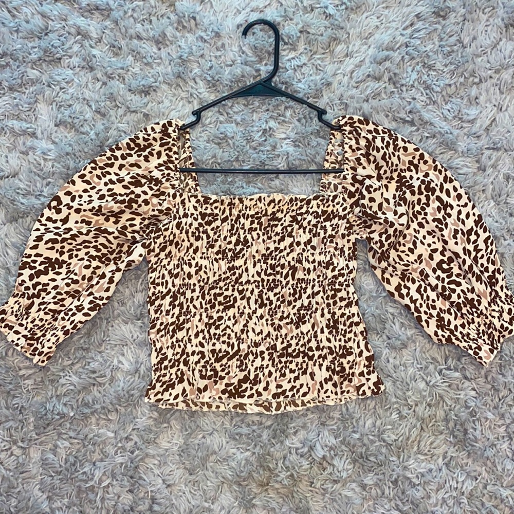 Small, fitted, square leopard print ruffle long sleeve top
